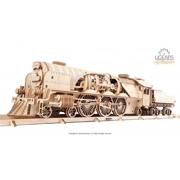 Detailed light wood mechanical steam train 3D puzzle with exposed gears and wheels on a wooden track.