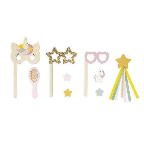 Pastel wooden toy props: unicorn mask, glittery star glasses, heart glasses, star wand, and small pink hairbrush.