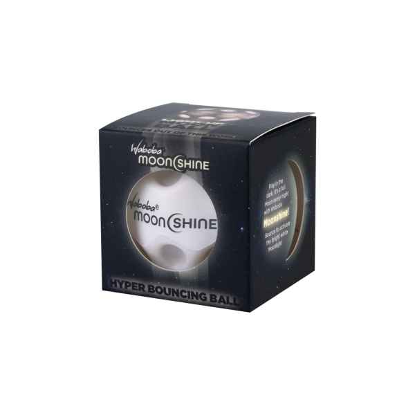 White cratered bouncy ball inside a black box with star patterns and Waboba MoonShine branding.