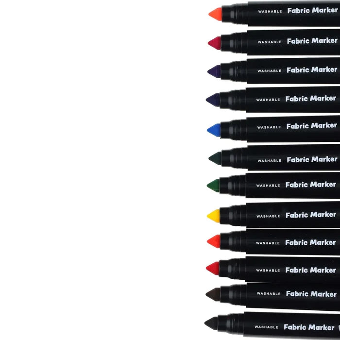 Twelve fabric markers with assorted colored tips and black barrels stacked vertically on a white background.