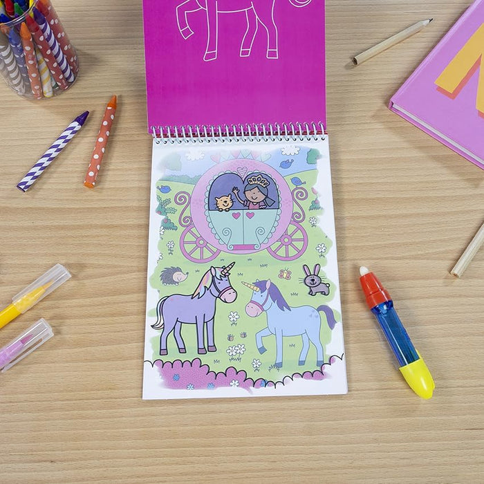Spiral-bound Water Magic book with colorful unicorn illustrations and a blue water pen on a wooden surface.