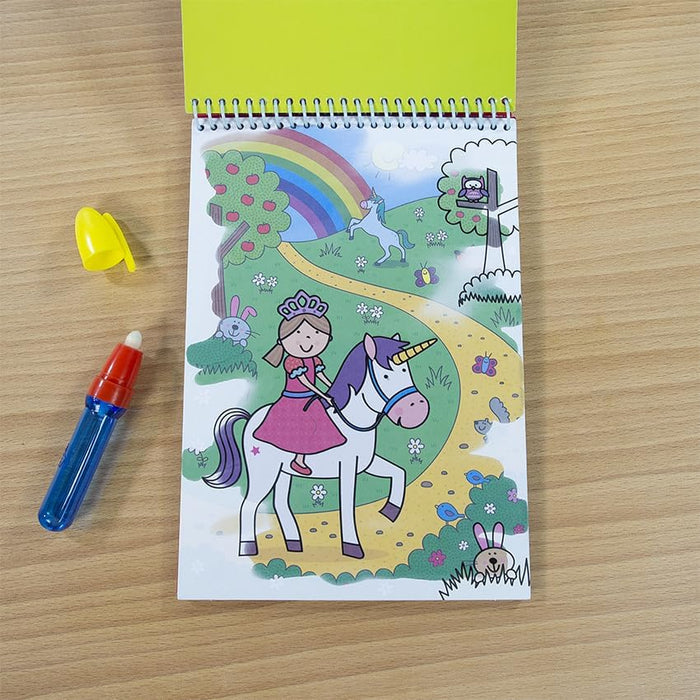 Spiral-bound Water Magic book with a unicorn scene, blue water pen, and yellow cap on a wooden table.