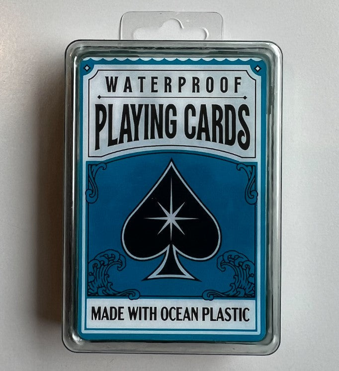 Blue and white waterproof playing cards in a clear case with ocean wave graphics and a black spade starburst logo.