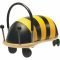 Yellow and black striped bumblebee ride-on toy with a padded body, curved black handle, and multidirectional wheels.