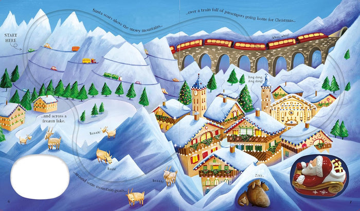 Snowy mountain children's book spread with a winding track and a small red wind-up Santa in his sleigh toy.