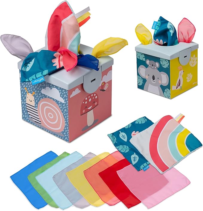 Colorful toy tissue box with animal illustrations and several multi-colored fabric scarves spilling out of the top.