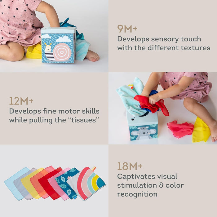 Blue toy tissue box with animal illustrations and colorful fabric cloths for developmental stages 9M+, 12M+, and 18M+.