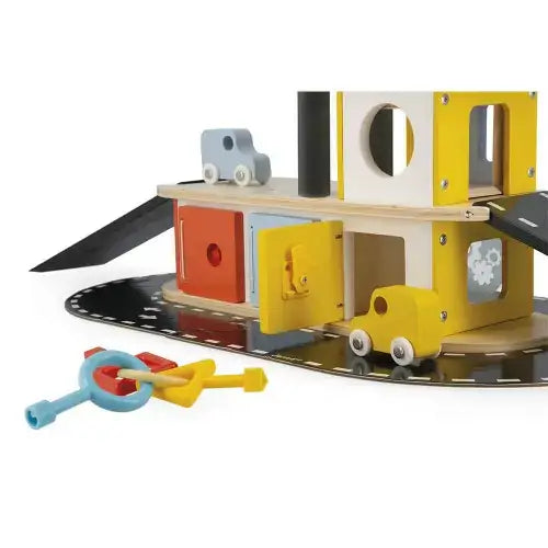 Wooden multi-story toy garage with yellow and red doors, black ramps, two toy cars, and three chunky matching keys.