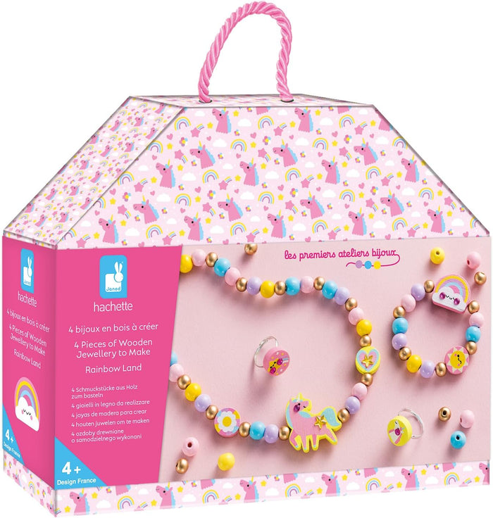Pink unicorn house box showing a wooden bead necklace, bracelet, and rings with rainbow and unicorn charms.