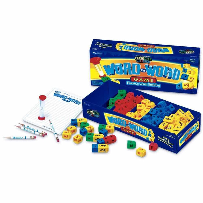 Blue game box with colorful interlocking letter blocks, a red sand timer, pencils, and a score pad.