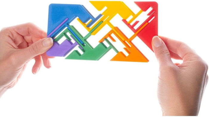 Hands holding a flat plastic sliding puzzle with interlocking zigzag pieces in blue, green, yellow, and orange.