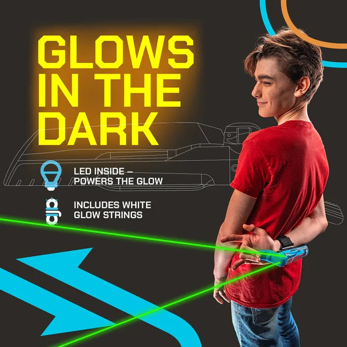Boy shoots glowing green strings from a blue wrist device. Yellow text reads GLOWS IN THE DARK.